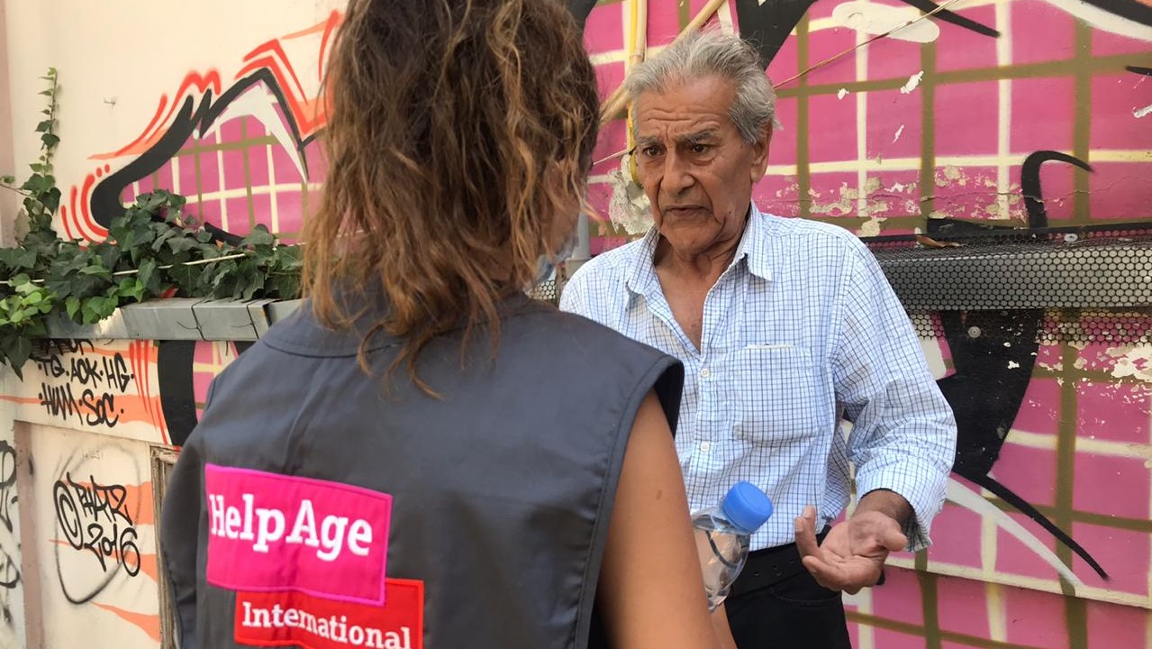 _878_https://www.helpage.org/silo/images/beirut-lebanon-explosion-talking-to-older-person_1279x720.jpg