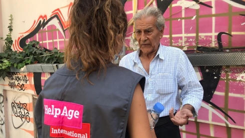 _586_https://www.helpage.org/silo/images/beirut-lebanon-explosion-talking-to-older-person_491x276.jpg