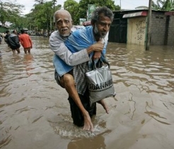  _225_https://www.helpage.org/silo/images/sri-lanka-flood-older-man-carried_246x211.jpg