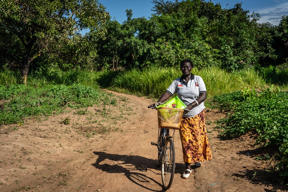  _411_https://www.helpage.org/silo/images/aber-helen-uma-walks-with-her-bike-that-she-uses-to-carry-out-ocm-work_1000x666.jpg