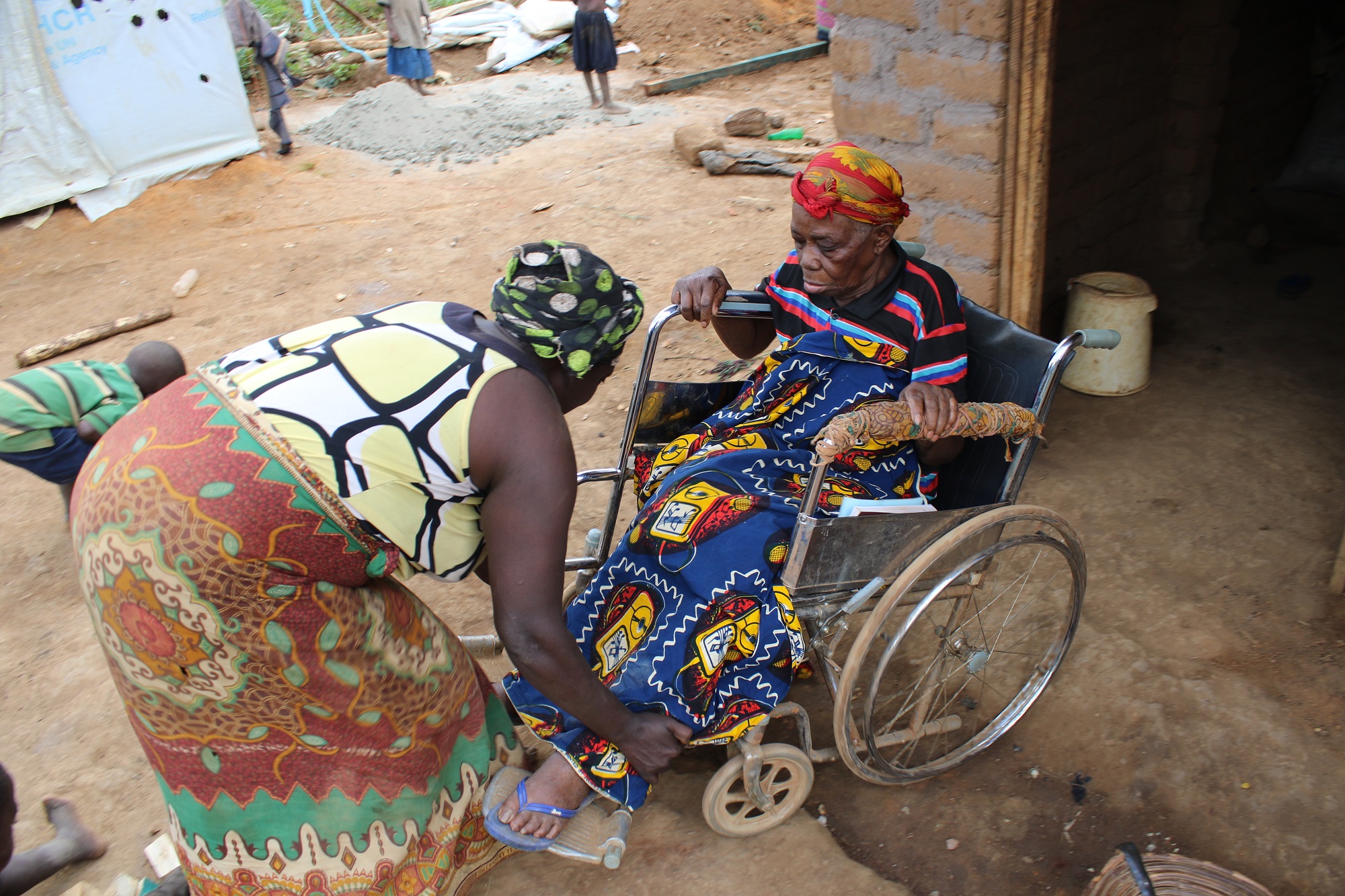  _838_https://www.helpage.org/silo/images/woman-on-a-wheelchair-in-tanzania-refugee-camp_2000x1333.jpg