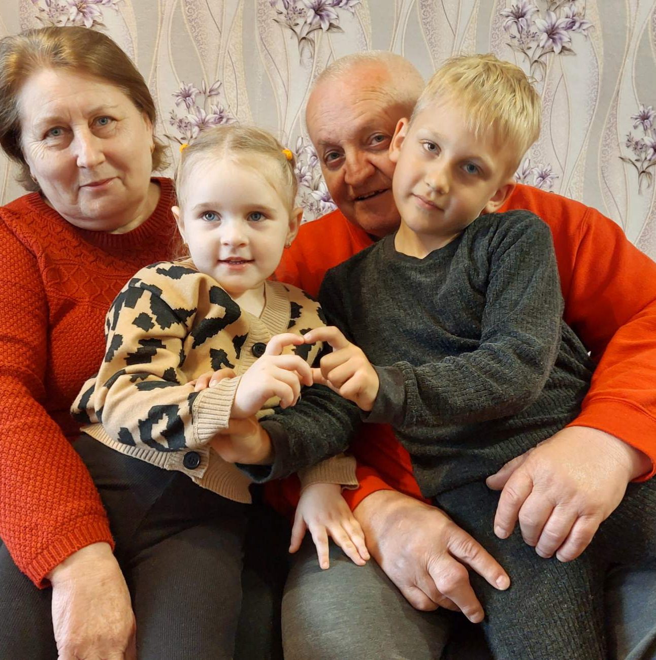 Vasyl, 65, with his wife Nadiia and two of their grandchildren